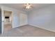 Neutral bedroom with carpet and ceiling fan, and standard closet at 119 Glendower Cir # 269, Sun City Center, FL 33573