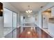 Dining room with adjacent mirrored wall offering views of the kitchen and living areas at 119 Glendower Cir # 269, Sun City Center, FL 33573