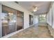 Bright Florida Room with tile flooring, ceiling fan and sliding glass doors, offering seamless indoor-outdoor living at 119 Glendower Cir # 269, Sun City Center, FL 33573