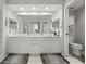 Bathroom features a double sink vanity with large mirror and tile flooring at 1200 Country Club Drive Dr # 3303, Largo, FL 33771