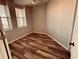 Cozy bedroom with wood floors and a bright window at 1200 Country Club Drive Dr # 3303, Largo, FL 33771
