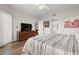 Bright bedroom featuring hardwood floors, neutral walls, and large windows offering natural light at 1200 Country Club Drive Dr # 3303, Largo, FL 33771