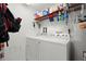 Functional laundry room with modern white washer and dryer at 1200 Country Club Drive Dr # 3303, Largo, FL 33771