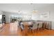 Bright living and dining area with wood floors, balcony, and elegant decor at 1200 Country Club Drive Dr # 3303, Largo, FL 33771