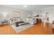 Bright open concept living room with hardwood flooring and comfortable seating at 1200 Country Club Drive Dr # 3303, Largo, FL 33771