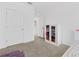 Bright bedroom with a closet and neutral carpeting offers ample space and storage at 16051 Weathered Windmill Ter, Odessa, FL 33556