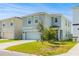 Charming two-story home features a well-manicured lawn and a two-car garage at 16051 Weathered Windmill Ter, Odessa, FL 33556