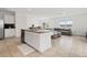 Bright, modern kitchen featuring an island with granite countertops, open to the living area at 16051 Weathered Windmill Ter, Odessa, FL 33556