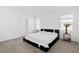 The main bedroom boasts carpeting and natural light from two windows at 16051 Weathered Windmill Ter, Odessa, FL 33556