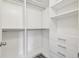 Walk-in closet with built-in shelving and drawers at 16170 Traditional Bluff Pl, Odessa, FL 33556