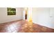 Light bedroom with tile flooring and ensuite bathroom at 1754 Patricia Ave, Dunedin, FL 34698