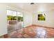 Bonus room with tile flooring and sliding glass doors to the outdoor patio area at 1754 Patricia Ave, Dunedin, FL 34698