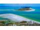 Breathtaking aerial view of Honeymoon Island State Park, featuring white sand beaches and clear waters at 1754 Patricia Ave, Dunedin, FL 34698