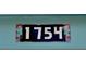 Close-up of a house number with an attractive stylized frame at 1754 Patricia Ave, Dunedin, FL 34698