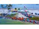 High & Dry Grill waterfront with colorful kayaks, boats, and beachside dining at 1754 Patricia Ave, Dunedin, FL 34698