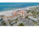 Coastal neighborhood with homes near a sandy beach, turquoise waters, and beautiful blue skies at 19 Somerset St, Clearwater Beach, FL 33767