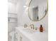 Stylish bathroom features white cabinets, quartz countertop, and brushed gold hardware at 19 Somerset St, Clearwater Beach, FL 33767