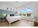 Bright bedroom showcasing a comfortable bed, natural light, and elegant decor, creating a peaceful atmosphere at 19 Somerset St, Clearwater Beach, FL 33767