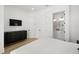 Bright bedroom with modern furnishings, light wood floors, and ensuite bathroom at 19 Somerset St, Clearwater Beach, FL 33767