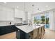 Elegant kitchen with a large island, modern appliances, and stylish bar seating at 19 Somerset St, Clearwater Beach, FL 33767