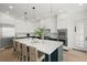 Stunning kitchen featuring a large island, custom cabinetry, and modern stainless steel appliances at 19 Somerset St, Clearwater Beach, FL 33767
