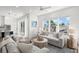Bright living room with contemporary furnishings, neutral tones, and natural light at 19 Somerset St, Clearwater Beach, FL 33767