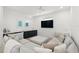 Inviting living room with a spacious sectional sofa, wet bar, and entertainment area, perfect for relaxation at 19 Somerset St, Clearwater Beach, FL 33767