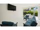 Charming outdoor entertainment area, complete with comfortable furniture, a TV, and a serene atmosphere at 19 Somerset St, Clearwater Beach, FL 33767