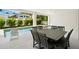 Stylish outdoor dining and pool area with comfortable seating at 19 Somerset St, Clearwater Beach, FL 33767
