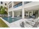 Relaxing pool with a tanning ledge and outdoor lounge furniture at 19 Somerset St, Clearwater Beach, FL 33767