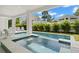 Inviting private pool with a clear, refreshing design surrounded by greenery at 19 Somerset St, Clearwater Beach, FL 33767