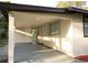 Attached carport offering shade and protection, seamlessly integrated with the home's design at 19455 Fort Dade Ave, Brooksville, FL 34601