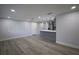 Unfurnished living room featuring grey LVP floors, neutral walls, and recessed lighting at 19455 Fort Dade Ave, Brooksville, FL 34601