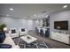 Open-concept living room flowing into the kitchen, styled with contemporary furniture and decor at 19455 Fort Dade Ave, Brooksville, FL 34601