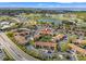 Aerial view of community featuring lush landscaping, golf course, and waterfront views at 1986 Pelican Landing Blvd # 1514, Clearwater, FL 33762