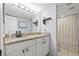 Bathroom with a white vanity, granite countertop, and shower at 1986 Pelican Landing Blvd # 1514, Clearwater, FL 33762