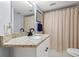 Bathroom featuring a white vanity with granite countertops and a shower/tub at 1986 Pelican Landing Blvd # 1514, Clearwater, FL 33762