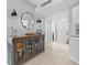 Light and bright foyer featuring tile floors, decorative lighting, a large mirror and a glass front console at 1986 Pelican Landing Blvd # 1514, Clearwater, FL 33762