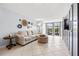 Bright living room showcasing tile floors, neutral walls, and access to a screened lanai at 1986 Pelican Landing Blvd # 1514, Clearwater, FL 33762
