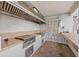 Outdoor kitchen with modern appliances, extensive counter space, and brick flooring at 1986 Pelican Landing Blvd # 1514, Clearwater, FL 33762