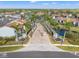 Aerial view of community entrance with lush palm trees and well-maintained landscaping at 1986 Pelican Landing Blvd # 1514, Clearwater, FL 33762