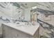 Stunning bathroom with double vanity, marble accent wall, and modern fixtures at 21205 Calle Rosa Dr # 10, Land O Lakes, FL 34637