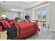 Grand bedroom showcasing a large mirror wall, massage table, and balcony access at 21205 Calle Rosa Dr # 10, Land O Lakes, FL 34637