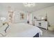 Bright bedroom boasts a white dresser, marble wall accent, and modern lighting at 21205 Calle Rosa Dr # 10, Land O Lakes, FL 34637
