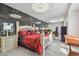 Lavish bedroom with marble wall, modern lighting, and massage table at 21205 Calle Rosa Dr # 10, Land O Lakes, FL 34637