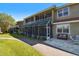 Townhome exterior featuring patios and balconies with lush landscaping at 21205 Calle Rosa Dr # 10, Land O Lakes, FL 34637