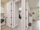 Hallway view to living area, laundry room with machines visible at 21205 Calle Rosa Dr # 10, Land O Lakes, FL 34637