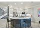 Kitchen with marble counter top island and stainless appliances is ideal for cooking and entertaining at 21205 Calle Rosa Dr # 10, Land O Lakes, FL 34637
