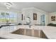 Modern kitchen features a marble countertop island and stainless steel sink at 21205 Calle Rosa Dr # 10, Land O Lakes, FL 34637