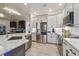 Spacious kitchen featuring stainless steel appliances and a marble countertop island at 21205 Calle Rosa Dr # 10, Land O Lakes, FL 34637